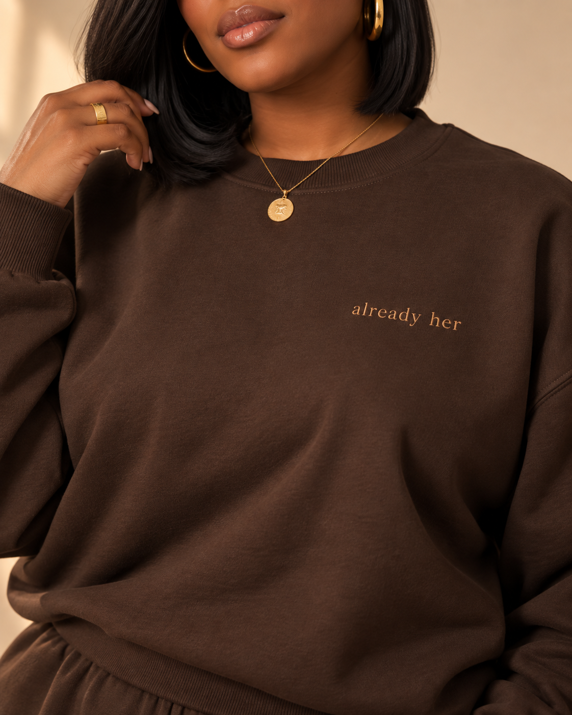 already her crewneck, brown