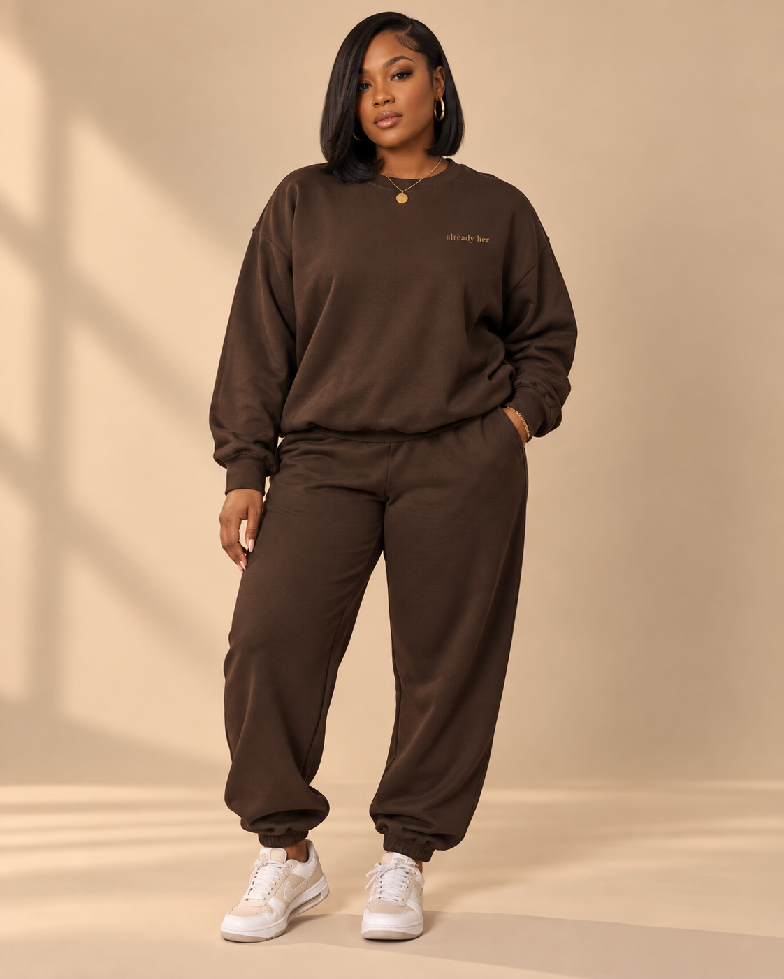 already her crewneck, brown